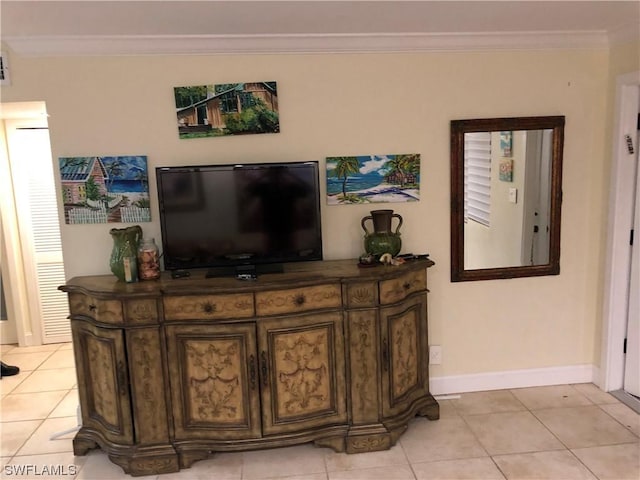 living room with crown molding and light tile patterned flooring