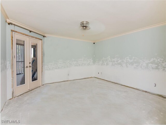 unfurnished room with crown molding, concrete floors, and french doors