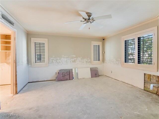 spare room featuring crown molding and ceiling fan