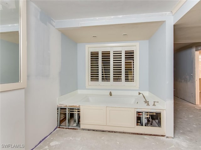 bathroom featuring a washtub