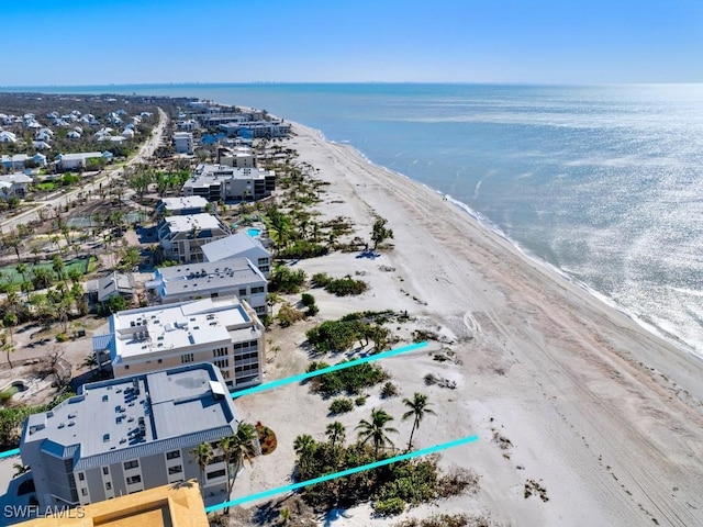 bird's eye view with a view of the beach and a water view