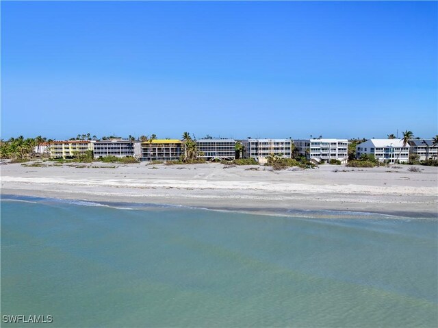 property view of water featuring a beach view