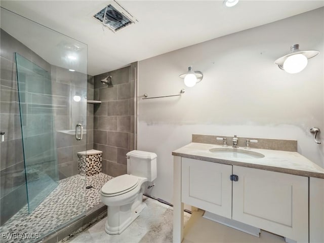 bathroom featuring walk in shower, vanity, and toilet