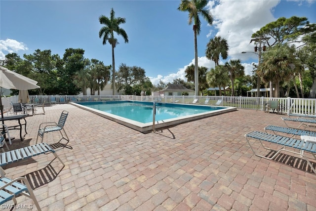 view of swimming pool with a patio area