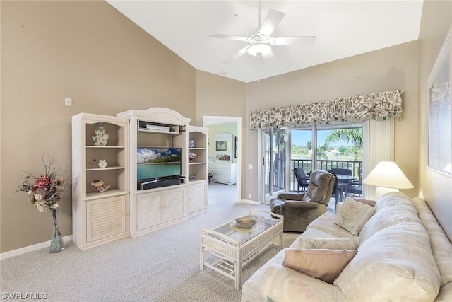 carpeted living room featuring ceiling fan and high vaulted ceiling