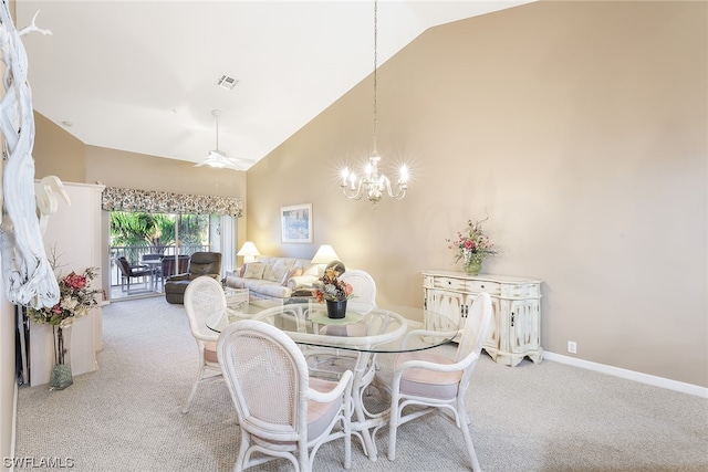 dining space featuring light carpet, high vaulted ceiling, and ceiling fan with notable chandelier