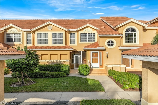 view of front of home with a front yard