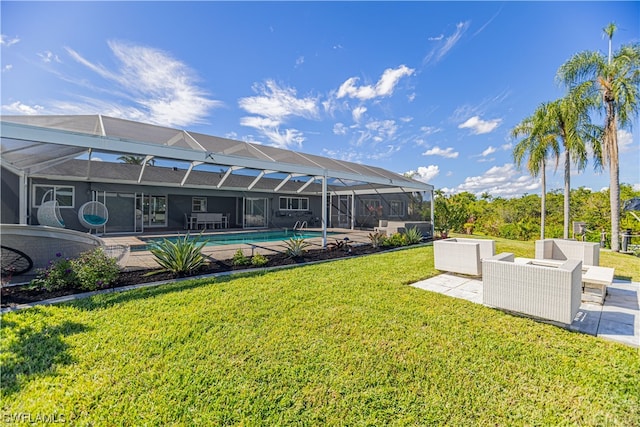 view of yard with a patio area, outdoor lounge area, and a lanai