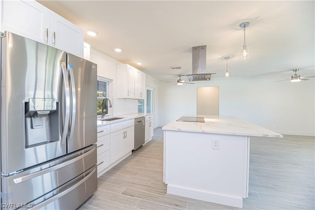 kitchen with stainless steel appliances, white cabinets, and ceiling fan