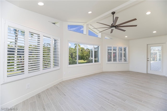 interior space with plenty of natural light, vaulted ceiling with beams, and ceiling fan