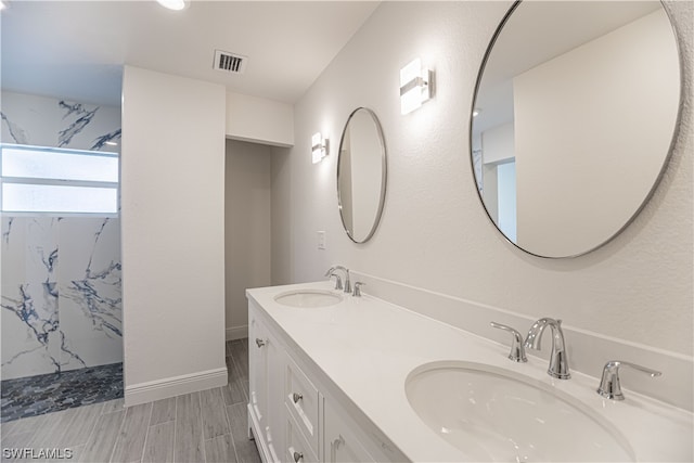 bathroom with double sink and oversized vanity