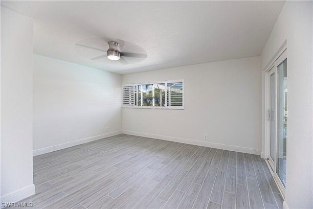 unfurnished room featuring ceiling fan and light wood-type flooring