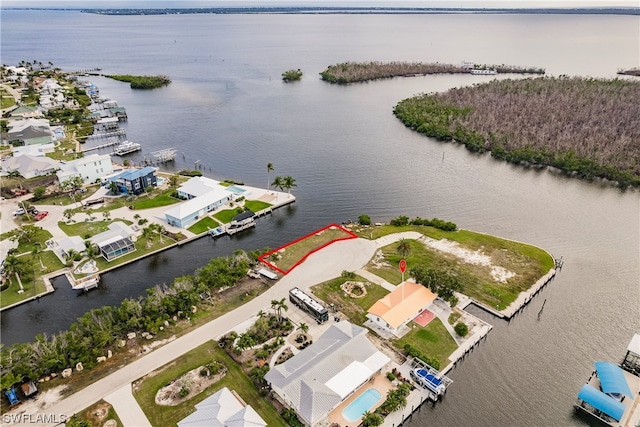 birds eye view of property featuring a water view