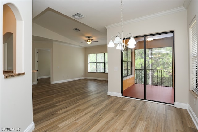 interior space featuring hardwood / wood-style flooring and ceiling fan with notable chandelier