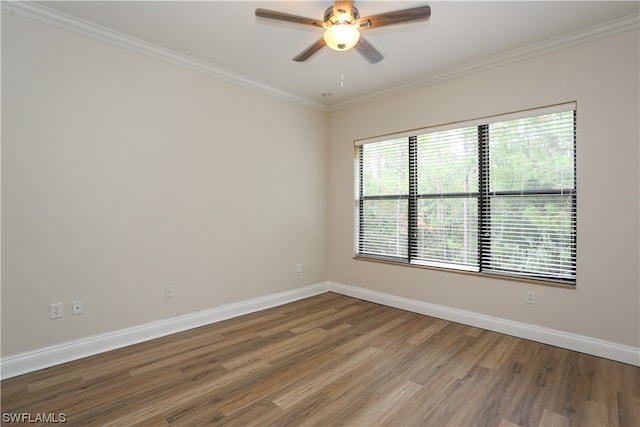 unfurnished room featuring crown molding, dark hardwood / wood-style flooring, and ceiling fan