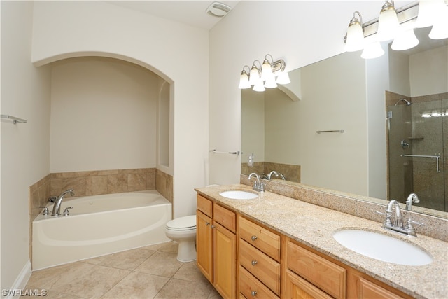 full bathroom with double sink vanity, toilet, shower with separate bathtub, and tile floors