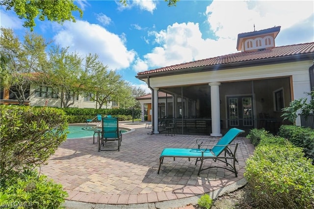 view of patio / terrace with a fenced in pool