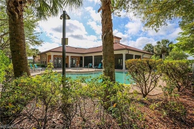 view of swimming pool with a patio area