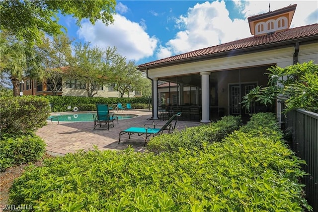 view of yard with a patio and a fenced in pool