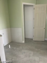 unfurnished room featuring light tile floors