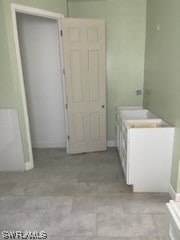 bathroom with tile flooring