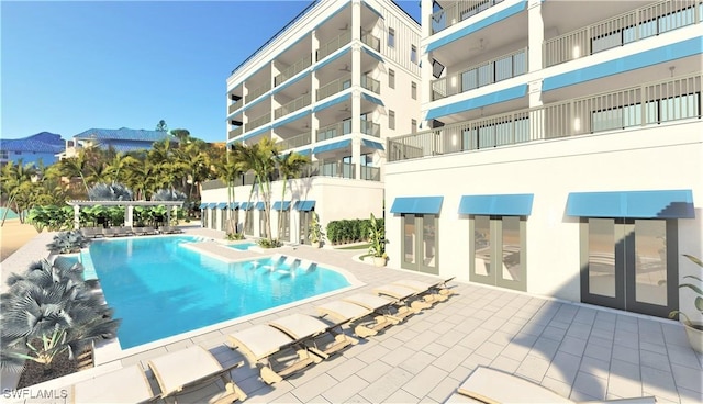 community pool featuring a patio area and a mountain view