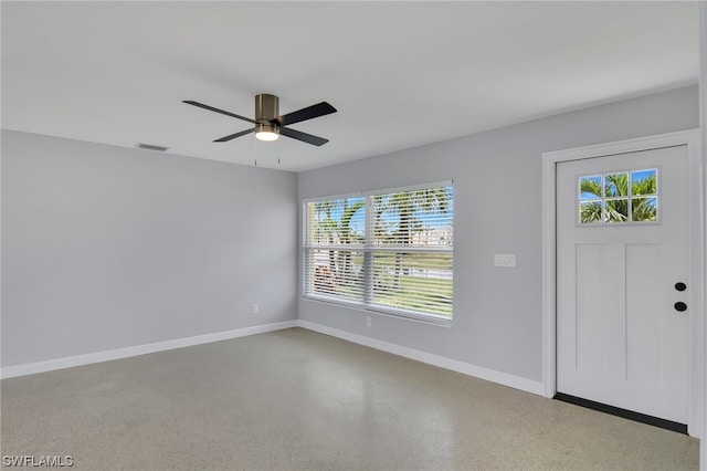 entrance foyer with ceiling fan