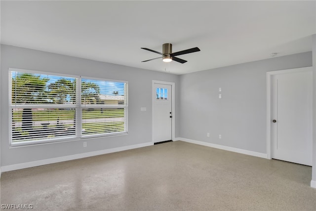 spare room with ceiling fan