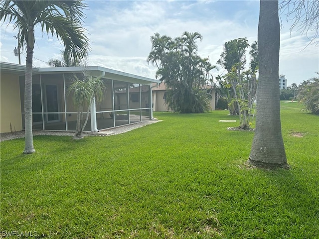 view of yard with a sunroom