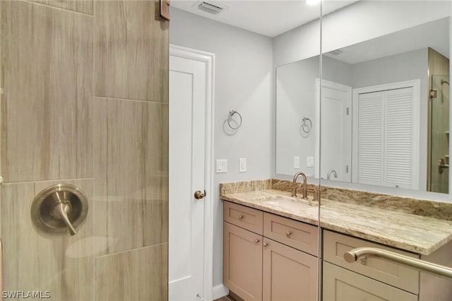 bathroom featuring vanity and walk in shower