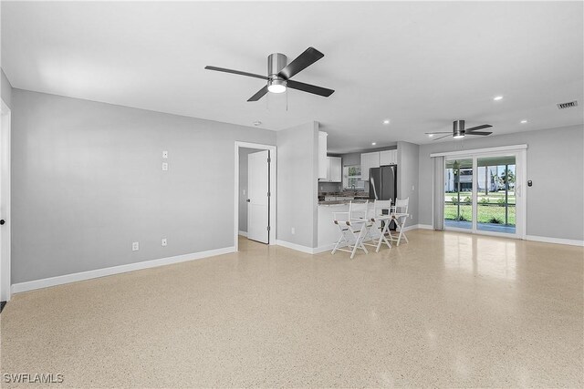 2 Fairview Blvd, Fort Myers Beach, FL 33931 - living room with a ceiling fan, recessed lighting, baseboards, and dark speckled floor