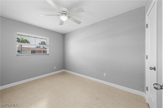 2 Fairview Blvd, Fort Myers Beach, FL 33931 - unfurnished room featuring speckled floor, baseboards, and ceiling fan