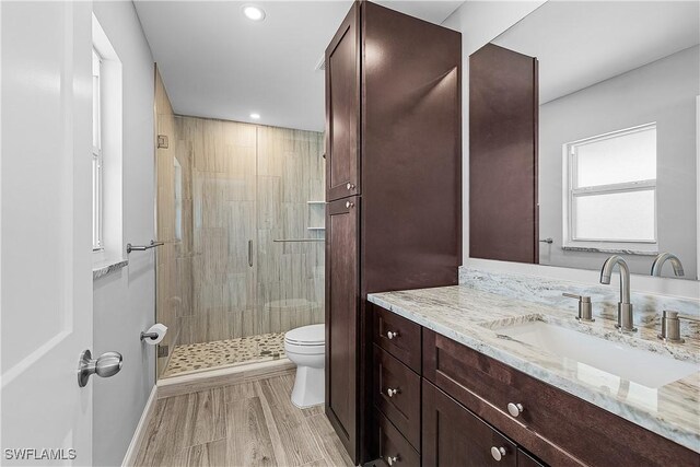 2 Fairview Blvd, Fort Myers Beach, FL 33931 - full bathroom featuring toilet, a shower stall, vanity, recessed lighting, and baseboards