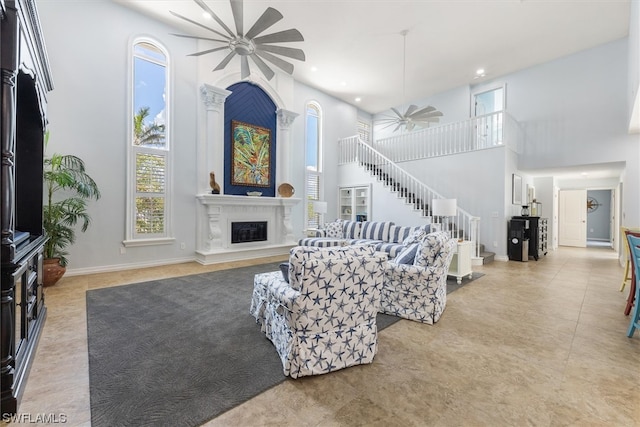 tiled living room featuring a towering ceiling