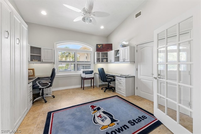 office featuring light tile flooring, vaulted ceiling, and ceiling fan