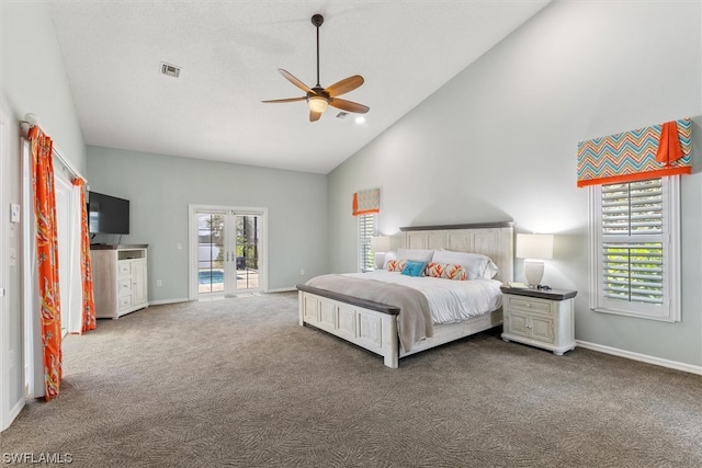 carpeted bedroom featuring ceiling fan, multiple windows, high vaulted ceiling, and french doors