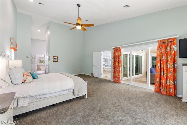 carpeted bedroom with access to outside, ceiling fan, and a towering ceiling