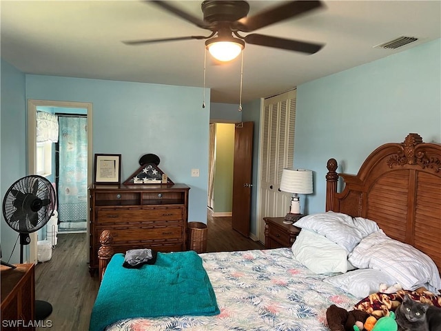 bedroom with dark wood-type flooring and ceiling fan