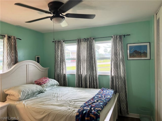 bedroom featuring ceiling fan and a closet