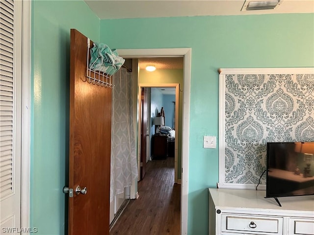 hall featuring dark wood-type flooring