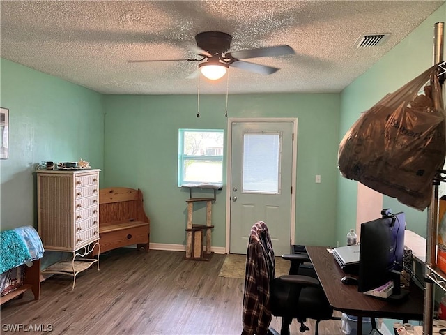 office space with hardwood / wood-style flooring, a textured ceiling, and ceiling fan