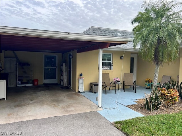 rear view of house featuring a carport