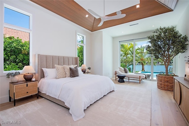 bedroom featuring recessed lighting, a ceiling fan, access to exterior, and light wood-style flooring