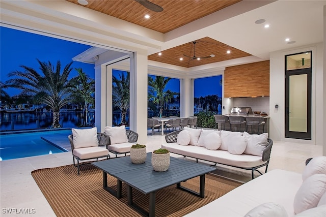 view of patio / terrace with outdoor lounge area, outdoor dining space, an outdoor kitchen, and ceiling fan