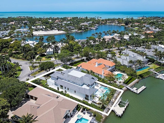 aerial view with a residential view and a water view