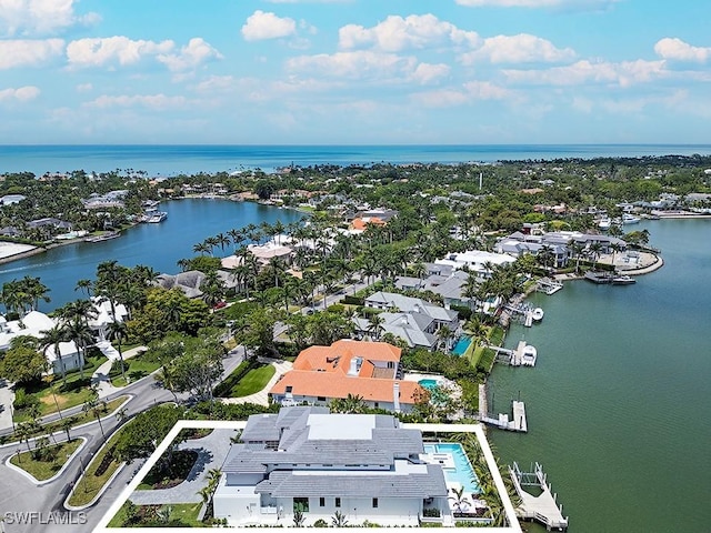 bird's eye view featuring a residential view and a water view