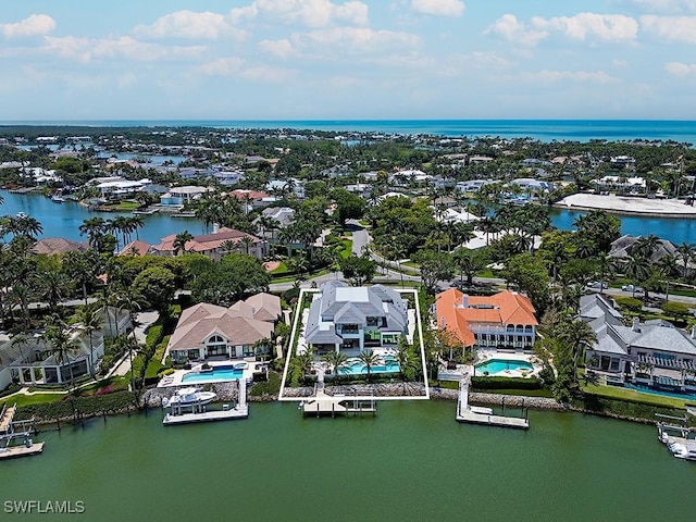 bird's eye view with a residential view and a water view