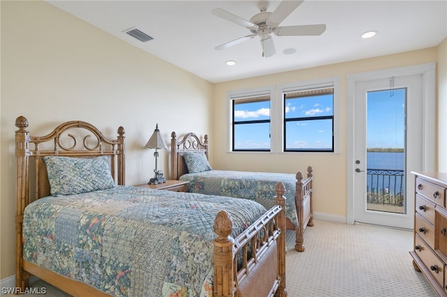 bedroom with light carpet, access to exterior, and ceiling fan