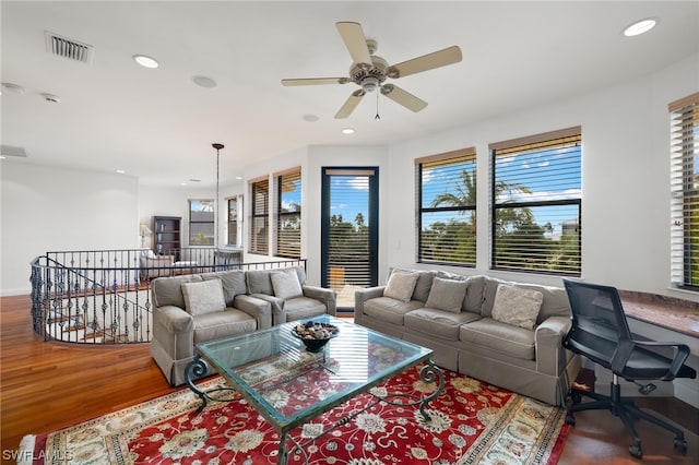 living room with ceiling fan and wood-type flooring