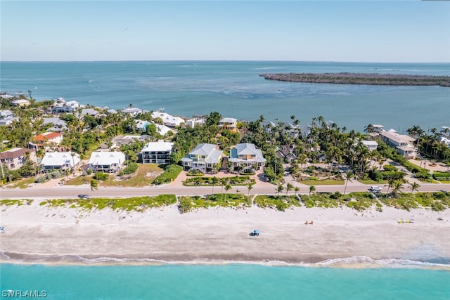 aerial view with a water view and a view of the beach